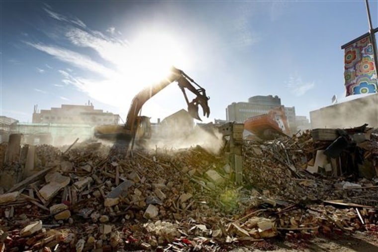 An excavator works this month on clearing rubble in downtown Christchurch, New Zealand.
